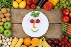 Tempting your kids to eat healthy with aSmiling face made from vegetables