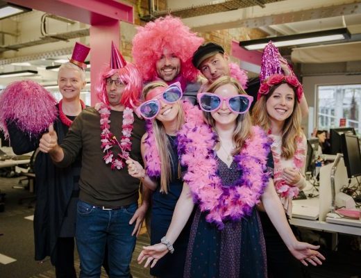 Office party with participants wearing pink