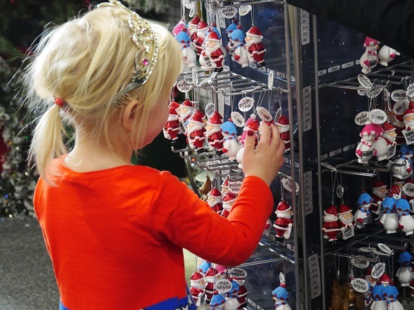 Girl looking at Christmas decorations